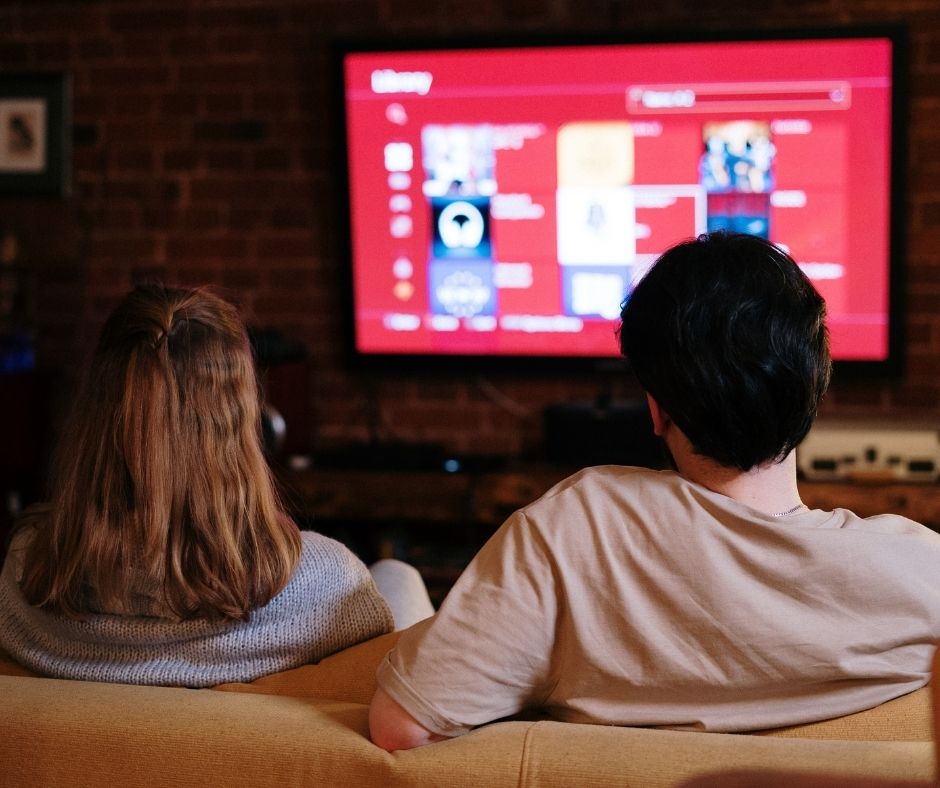A couple watching Netflix on TV